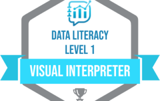 Data Literacy Visual Interpreter Badge. Badge is a hexagon. Inside at the top is the blue data literacy logo. Below in blue text it reads data literacy level 1. A blue ribbon across the badge reads visual interpreter in white text. A grey medal sits at the bottom of the hexagon.